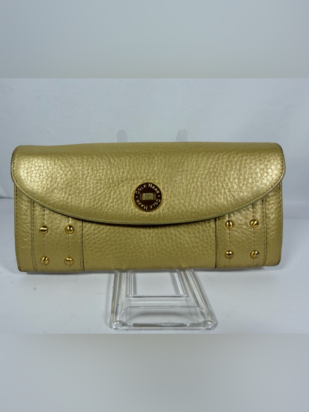2150: Cole Haan metallic gold leather studded continental wallet